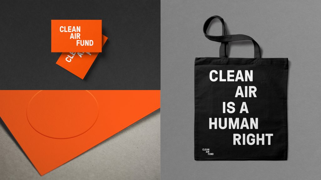 A range of materials printed with the Clean Air Fund logo (clockwise from top left): business cards, a tote bag and the corner of a pamphlet.