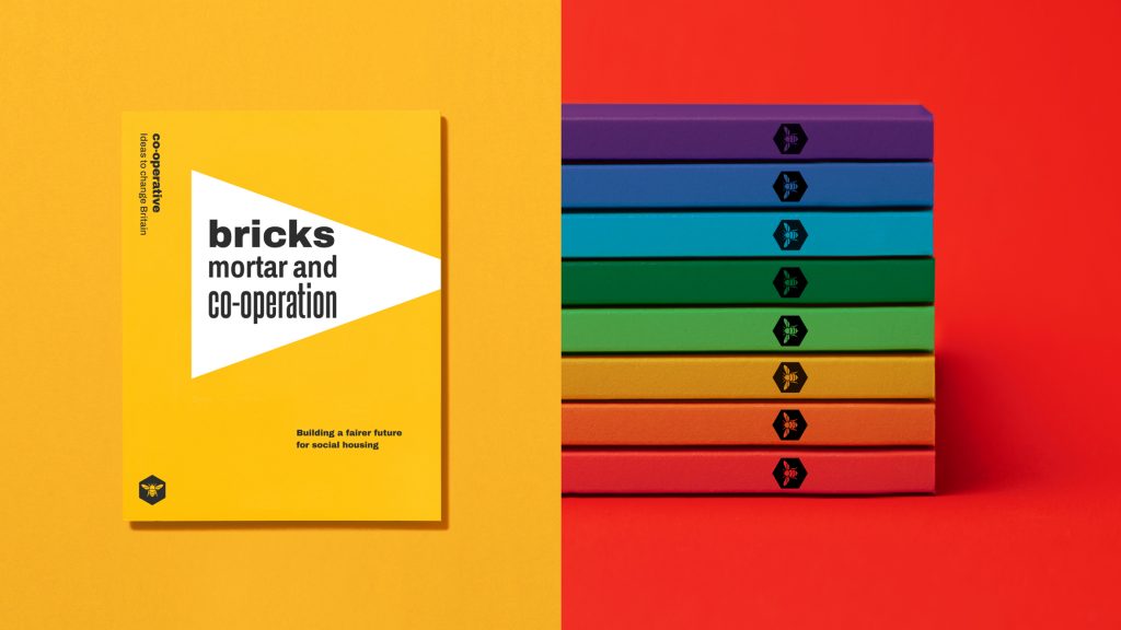 Examples of publications in the new brand, (left) a report cover and (right) publication spines in different colours.