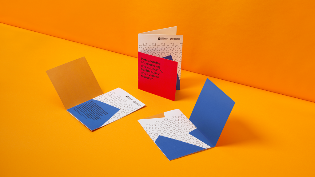 A mock-up of three publications showing a range of designs and fold-out covers.