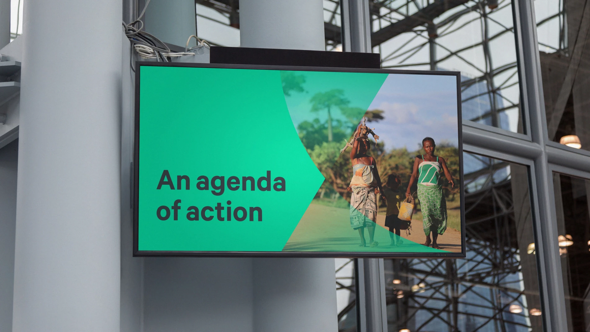 A mock-up of an SEI-branded presentation on a conference screen.