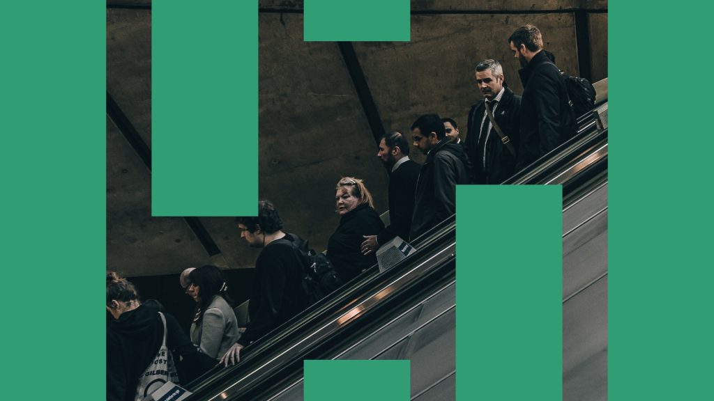 A photograph of people going down an escalator, with green bars overlaid. Part of the IFS rebrand.