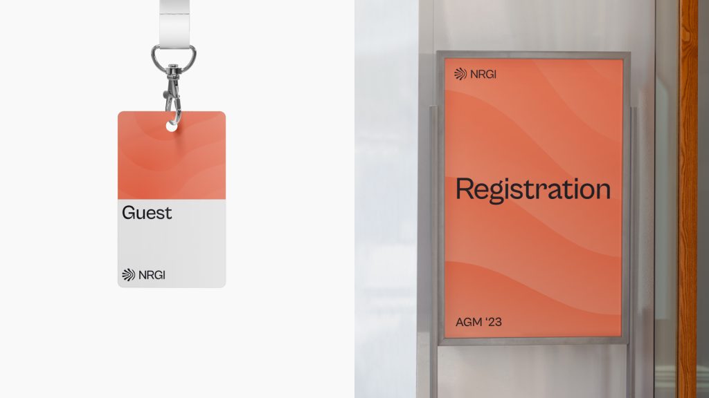 A mock-up of a lanyard and registration sign for an event.